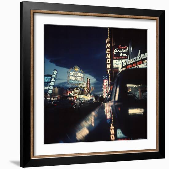 Fremont Street at Night Lit Up by Gambling Casino Neon Signs-Nat Farbman-Framed Photographic Print