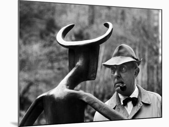 French Actor Jacques Tati Looking at a Sculpture-Yale Joel-Mounted Premium Photographic Print