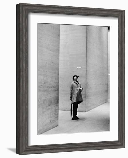 French Actor Jacques Tati Looking at the High Ceiling of an Office Lobby-Yale Joel-Framed Premium Photographic Print