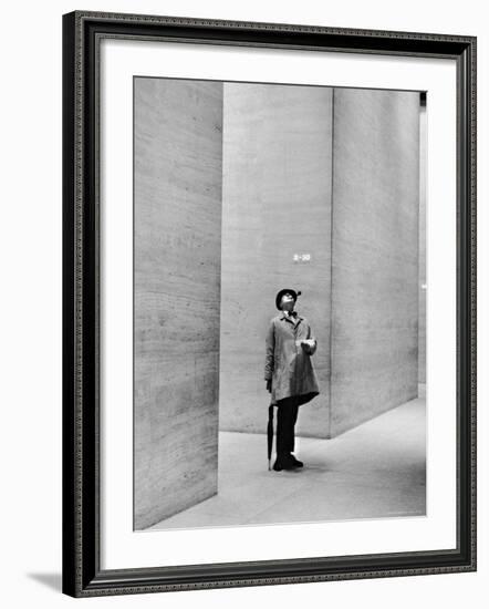 French Actor Jacques Tati Looking at the High Ceiling of an Office Lobby-Yale Joel-Framed Premium Photographic Print