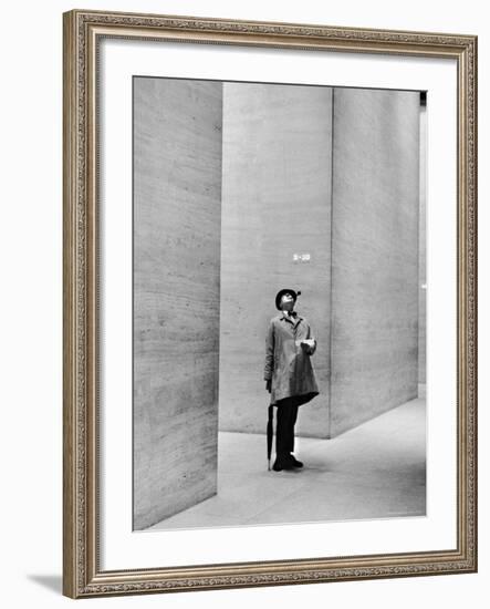 French Actor Jacques Tati Looking at the High Ceiling of an Office Lobby-Yale Joel-Framed Premium Photographic Print