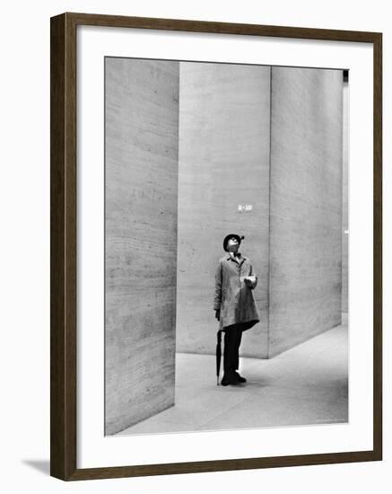 French Actor Jacques Tati Looking at the High Ceiling of an Office Lobby-Yale Joel-Framed Premium Photographic Print
