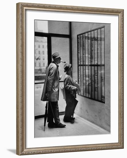 French Actor Jacques Tati Looking at the Names of a Building-Yale Joel-Framed Premium Photographic Print