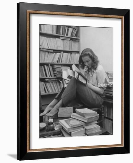 French Actress Barbara Laage, Alone in Her Apartment Reading-Nina Leen-Framed Photographic Print