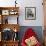 French Actress Barbara Laage, Alone in Her Apartment Reading-Nina Leen-Framed Photographic Print displayed on a wall