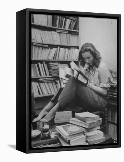 French Actress Barbara Laage in Her Apartment Reading-null-Framed Premier Image Canvas