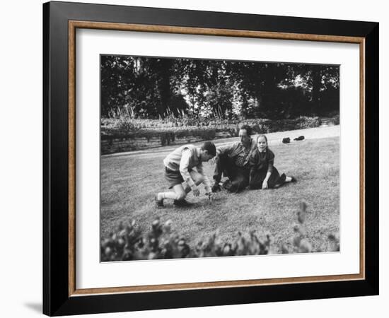 French Author, Albert Camus at His Home, Sitting in Garden with His Young Son and Daughter-Loomis Dean-Framed Photographic Print