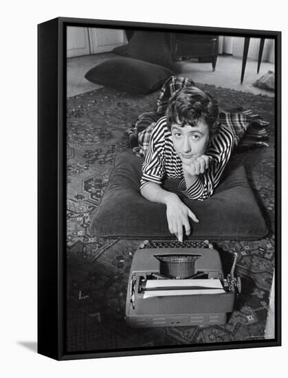 French Authoress Francoise Sagan, Laying on the Floor Typing-Thomas D^ Mcavoy-Framed Premier Image Canvas