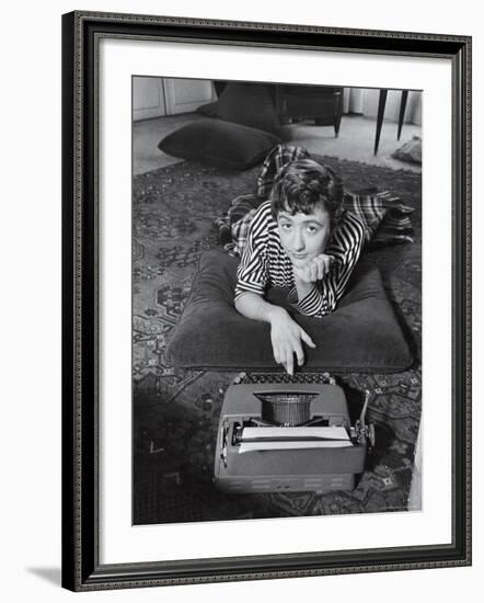 French Authoress Francoise Sagan, Laying on the Floor Typing-Thomas D^ Mcavoy-Framed Premium Photographic Print