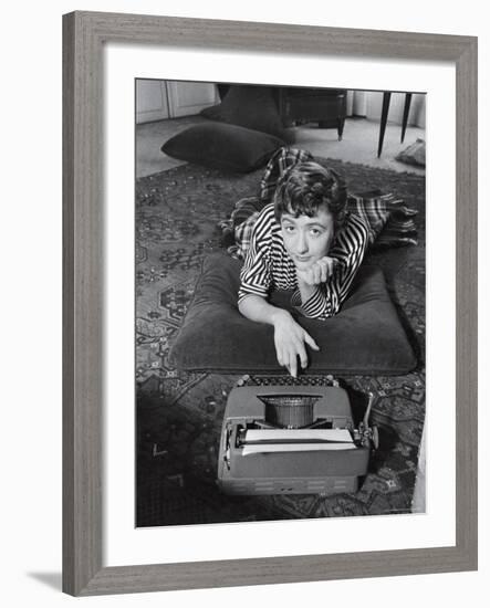 French Authoress Francoise Sagan, Laying on the Floor Typing-Thomas D^ Mcavoy-Framed Premium Photographic Print