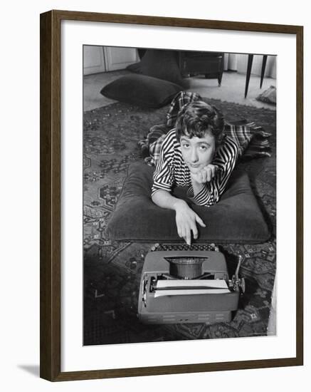 French Authoress Francoise Sagan, Laying on the Floor Typing-Thomas D^ Mcavoy-Framed Premium Photographic Print