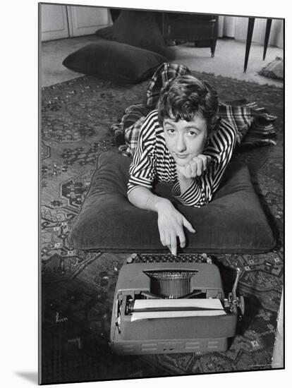 French Authoress Francoise Sagan, Laying on the Floor Typing-Thomas D^ Mcavoy-Mounted Premium Photographic Print