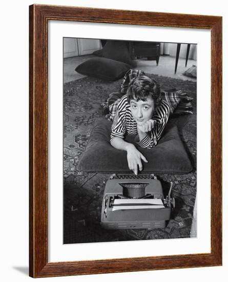 French Authoress Francoise Sagan, Laying on the Floor Typing-Thomas D^ Mcavoy-Framed Premium Photographic Print