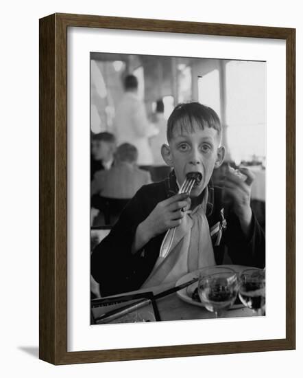 French Boy Andre Poindeeault Mastering a Big Bite-Nat Farbman-Framed Photographic Print