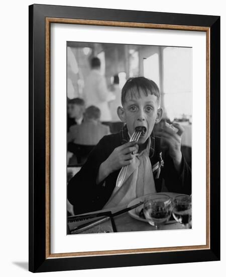 French Boy Andre Poindeeault Mastering a Big Bite-Nat Farbman-Framed Photographic Print