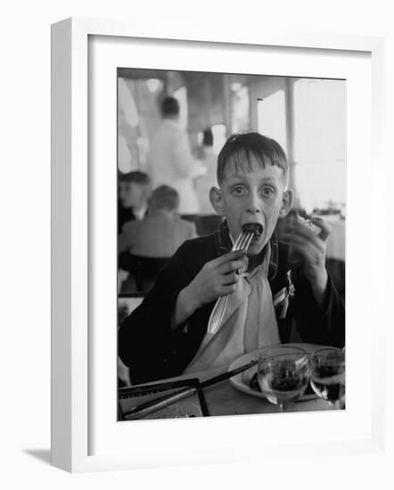 French Boy Andre Poindeeault Mastering a Big Bite-Nat Farbman-Framed Photographic Print