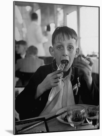 French Boy Andre Poindeeault Mastering a Big Bite-Nat Farbman-Mounted Photographic Print