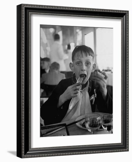 French Boy Andre Poindeeault Mastering a Big Bite-Nat Farbman-Framed Photographic Print