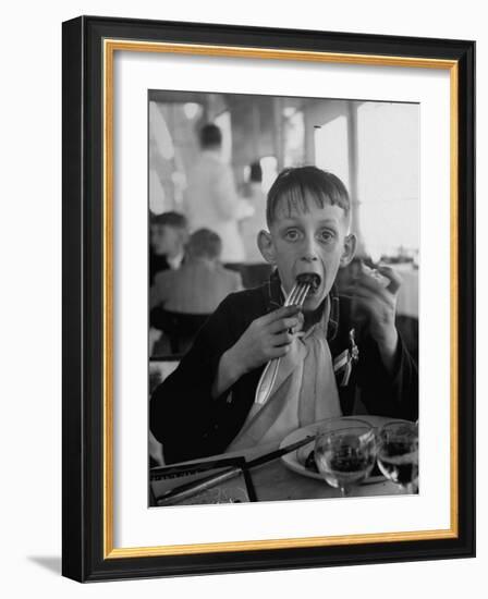 French Boy Andre Poindeeault Mastering a Big Bite-Nat Farbman-Framed Photographic Print