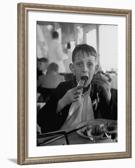 French Boy Andre Poindeeault Mastering a Big Bite-Nat Farbman-Framed Photographic Print