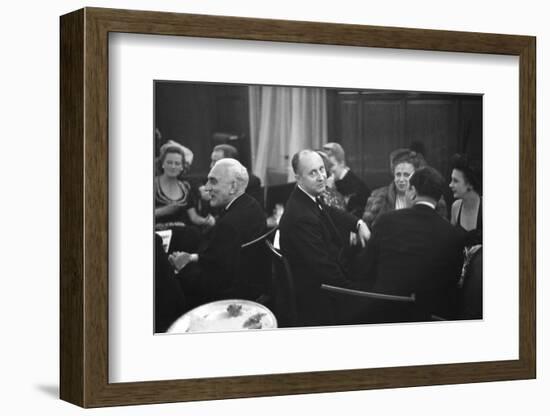 French Designer Christian Dior Drinking with Unidentified Others at a Bar, Paris, November 1947-Frank Scherschel-Framed Photographic Print