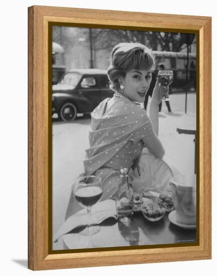 French Fashion Model Marie Helene Arnaud Sitting at a Cafe-Loomis Dean-Framed Premier Image Canvas