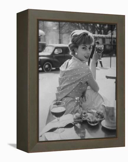 French Fashion Model Marie Helene Arnaud Sitting at a Cafe-Loomis Dean-Framed Premier Image Canvas