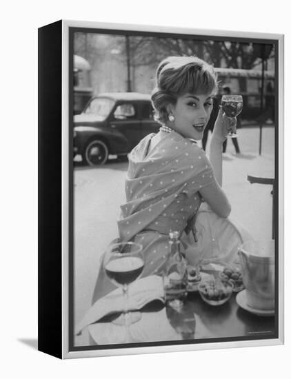 French Fashion Model Marie Helene Arnaud Sitting at a Cafe-Loomis Dean-Framed Premier Image Canvas