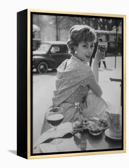 French Fashion Model Marie Helene Arnaud Sitting at a Cafe-Loomis Dean-Framed Premier Image Canvas