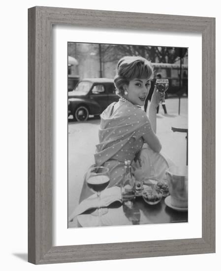 French Fashion Model Marie Helene Arnaud Sitting at a Cafe-Loomis Dean-Framed Photographic Print