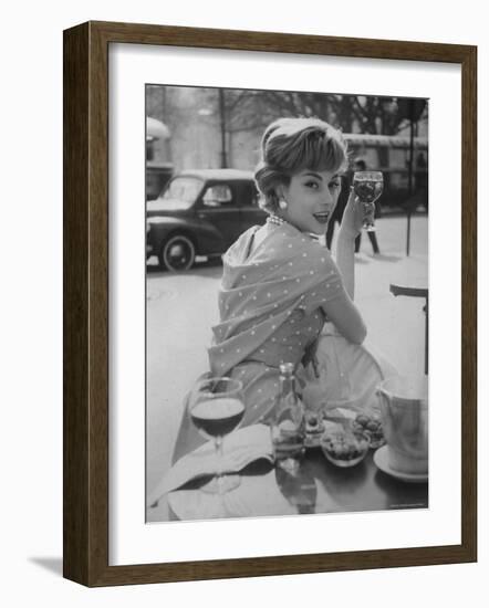 French Fashion Model Marie Helene Arnaud Sitting at a Cafe-Loomis Dean-Framed Photographic Print