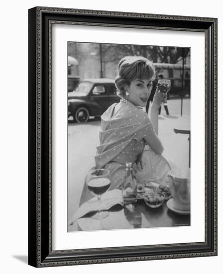 French Fashion Model Marie Helene Arnaud Sitting at a Cafe-Loomis Dean-Framed Photographic Print