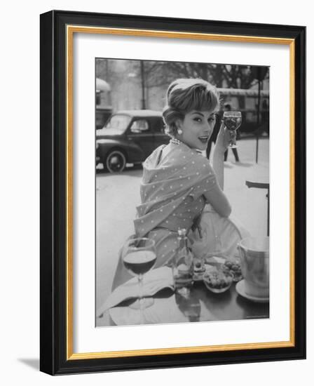 French Fashion Model Marie Helene Arnaud Sitting at a Cafe-Loomis Dean-Framed Photographic Print