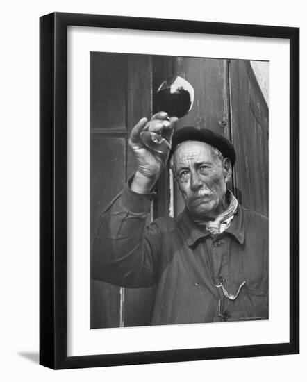 French Man Looking at How Clear the Wine Is-Thomas D^ Mcavoy-Framed Photographic Print