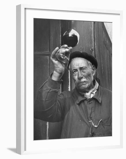 French Man Looking at How Clear the Wine Is-Thomas D^ Mcavoy-Framed Photographic Print