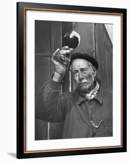 French Man Looking at How Clear the Wine Is-Thomas D^ Mcavoy-Framed Photographic Print