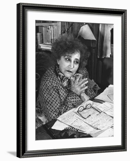 French Novelist Colette, at Desk Covered with Handwritten Notes Topped by Reading Glasses at Home-David Scherman-Framed Premium Photographic Print