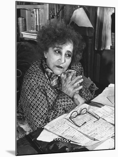 French Novelist Colette, at Desk Covered with Handwritten Notes Topped by Reading Glasses at Home-David Scherman-Mounted Premium Photographic Print