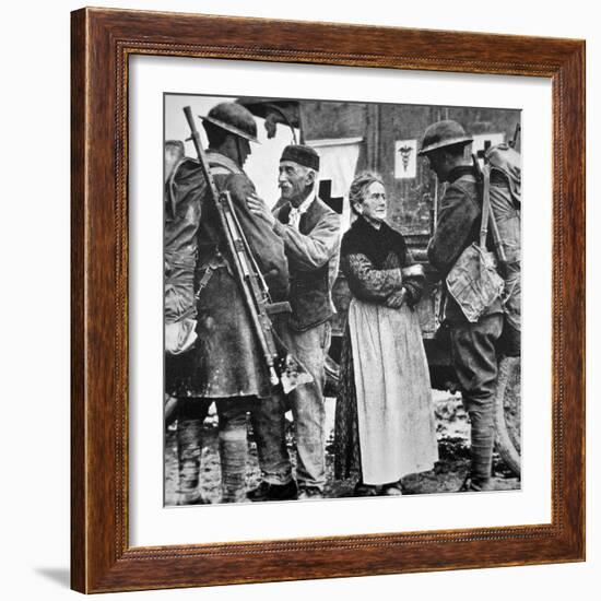 French Peasants Greet Two Heavily-Laden Americans, 1917-American Photographer-Framed Photographic Print