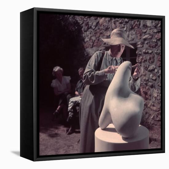 French Sculptor Jean Arp, Alone, Polishing Abstract Sculpture in His Garden Near Paris-Gjon Mili-Framed Premier Image Canvas