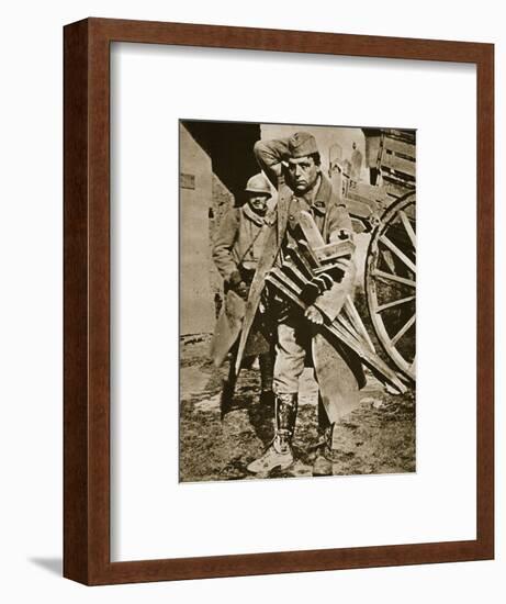 French soldier with wooden crosses to be placed on temporary graves, World War I, c1914-c1918-Unknown-Framed Photographic Print