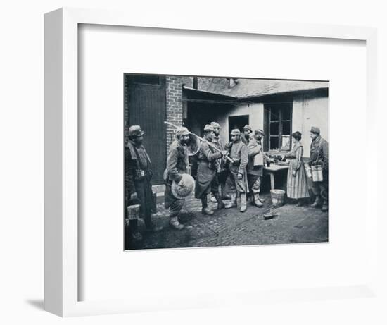 French soldiers returning from the trenches make a halt for refreshment, c1914-Unknown-Framed Photographic Print