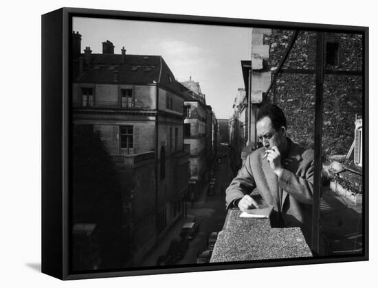 French Writer Albert Camus Smoking Cigarette on Balcony Outside His Publishing Firm Office-Loomis Dean-Framed Premier Image Canvas