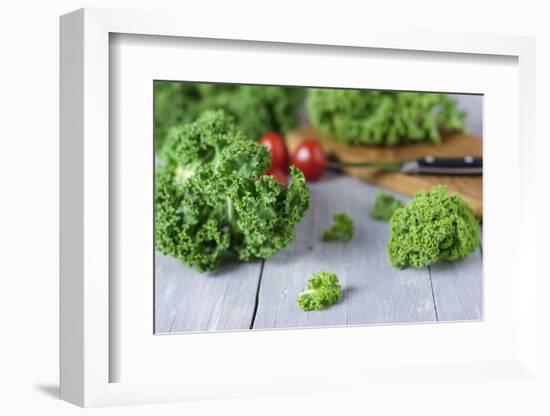Fresh Curly Cale and Tomatoes on Grey Wooden Table-Jana Ihle-Framed Photographic Print