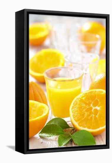 Fresh Pressed Orange Juice and Oranges-Jana Ihle-Framed Premier Image Canvas