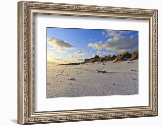 Fresh Spring Snow at Dawn Highlight Ripples and Marks in the Sand Beneath Bamburgh Castle-Eleanor-Framed Photographic Print