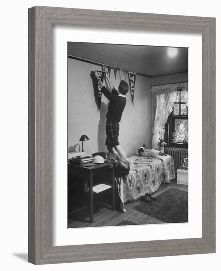 Freshman Mary Lloyd-Rees Hanging Both Harvard and Yale Banners in Her Room-Lisa Larsen-Framed Photographic Print