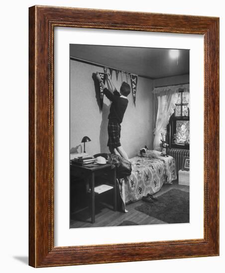 Freshman Mary Lloyd-Rees Hanging Both Harvard and Yale Banners in Her Room-Lisa Larsen-Framed Photographic Print