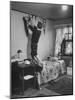 Freshman Mary Lloyd-Rees Hanging Both Harvard and Yale Banners in Her Room-Lisa Larsen-Mounted Photographic Print