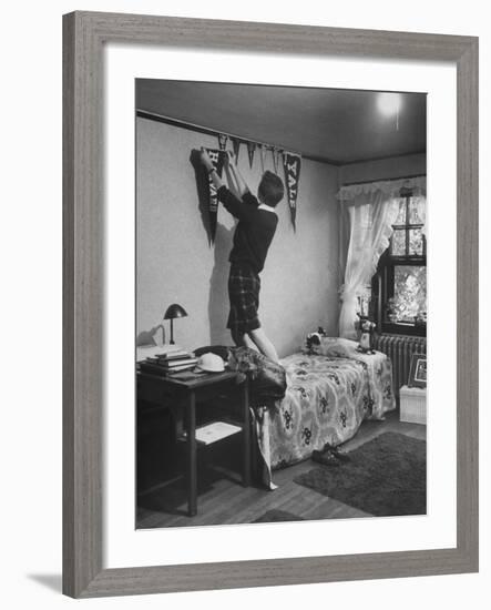 Freshman Mary Lloyd-Rees Hanging Both Harvard and Yale Banners in Her Room-Lisa Larsen-Framed Photographic Print